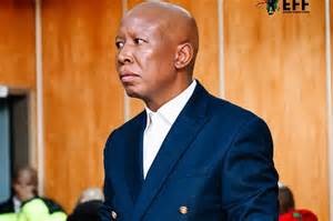 Afbeelding van een protestbijeenkomst met Julius Malema