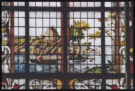 Detail van een gebrandschilderd raam met dorpsgezicht