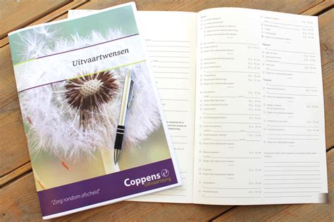 Een afbeelding van een wensenboekje met pen, symbool voor het vastleggen van uitvaartwensen.