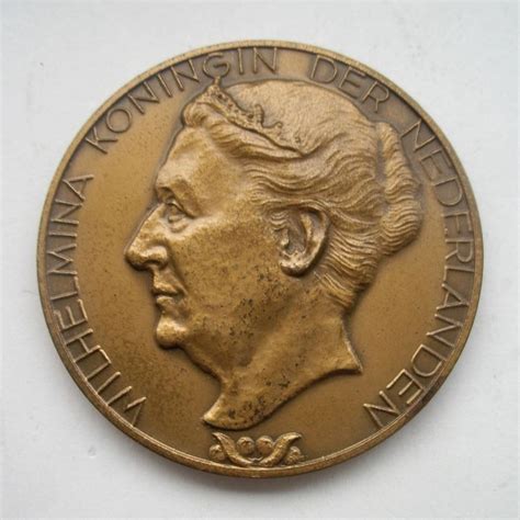 afbeelding van een gouden penning geslagen ter gelegenheid van de Synode van Dordrecht